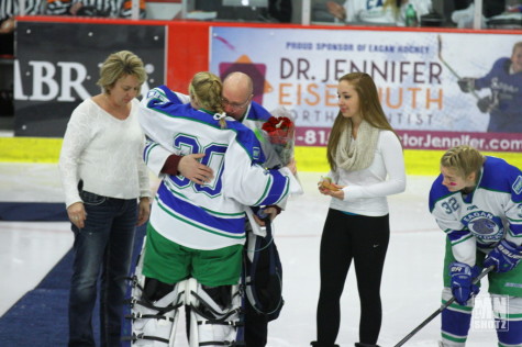 Junior, Katelyn Vrieze, hugging Steve Plashko.